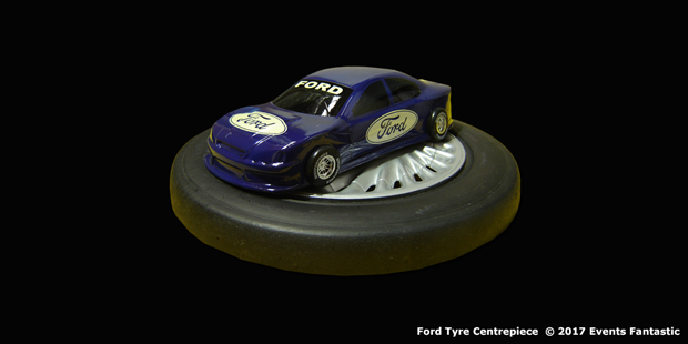 Ford car centrepiece on a rotating slick tyre