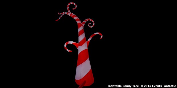 A brightly lit, red and white striped inflatable tree with multiple curved branches stands against a black background. The image is credited to Events Fantastic.