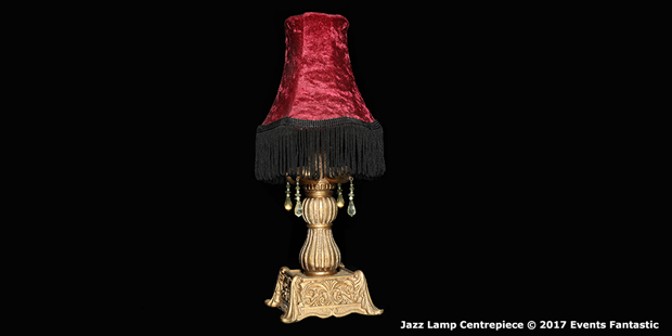 Antique Jazz lamp centrepiece with red shade and black tassels