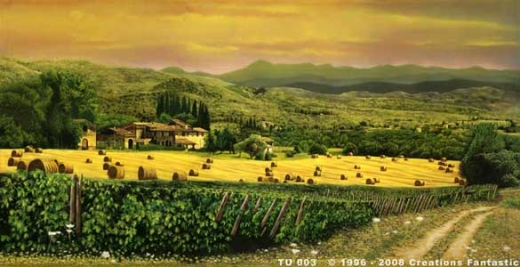 A picturesque rural landscape in Tuscany featuring a charming farmhouse, golden fields with rolled hay bales, lush greenery, and mountains in the distance under a warm, hazy sky. Ideal for a rental vacation or to explore the quaint apartments nearby.