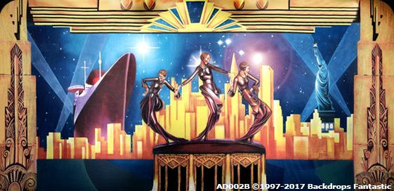 Art Deco-inspired party backdrop with abstract statues of three dancers in the foreground, a skyline, the Sydney Opera House, and the Statue of Liberty against a starry sky. Text "AD002B © 1997-2017 Backdrops Fantastic.