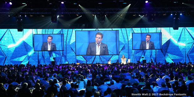 Conference event with guests looking at speaker