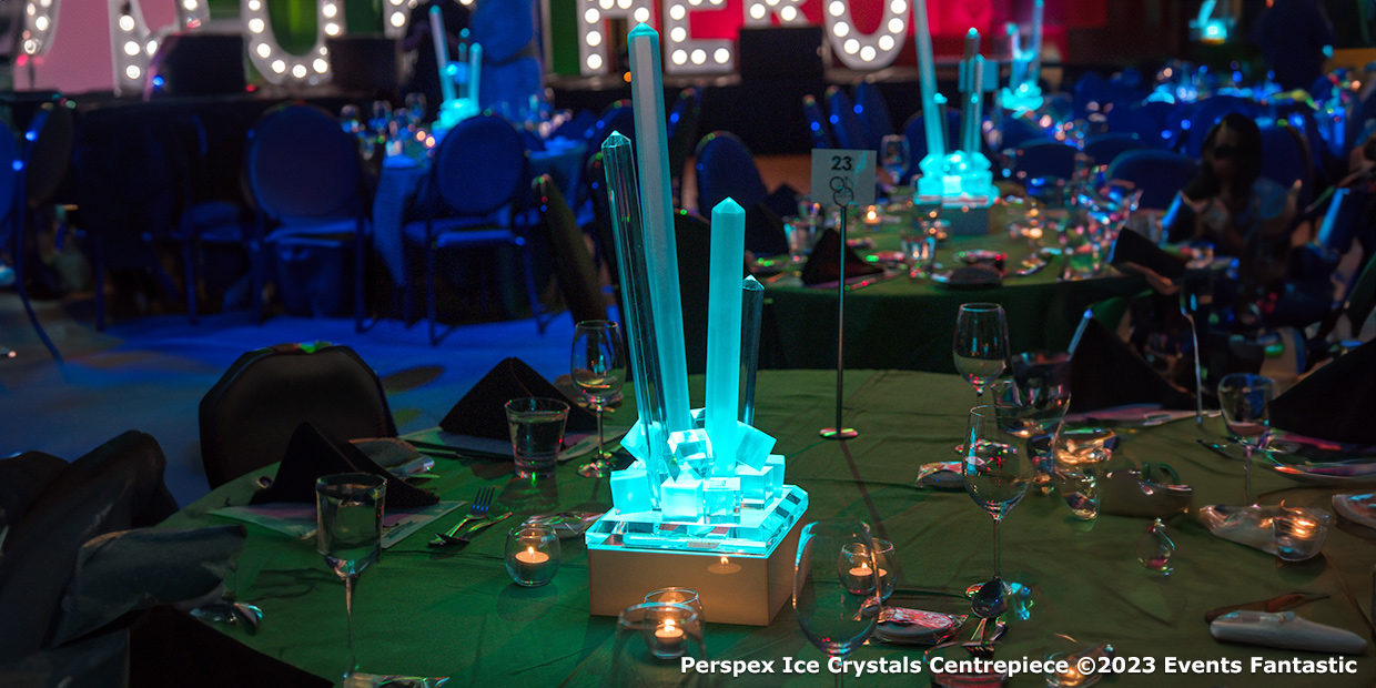 A glowing Perspex Ice Crystals Centrepiece graced the decorated table, casting a mesmerizing light in the dimly lit event space.