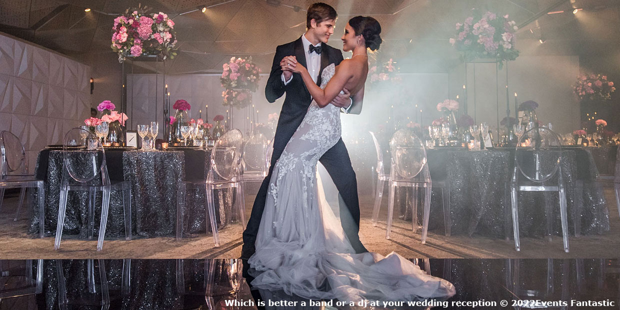 Photo of a couple dancing at a wedding in front of the stealth modular backdrop