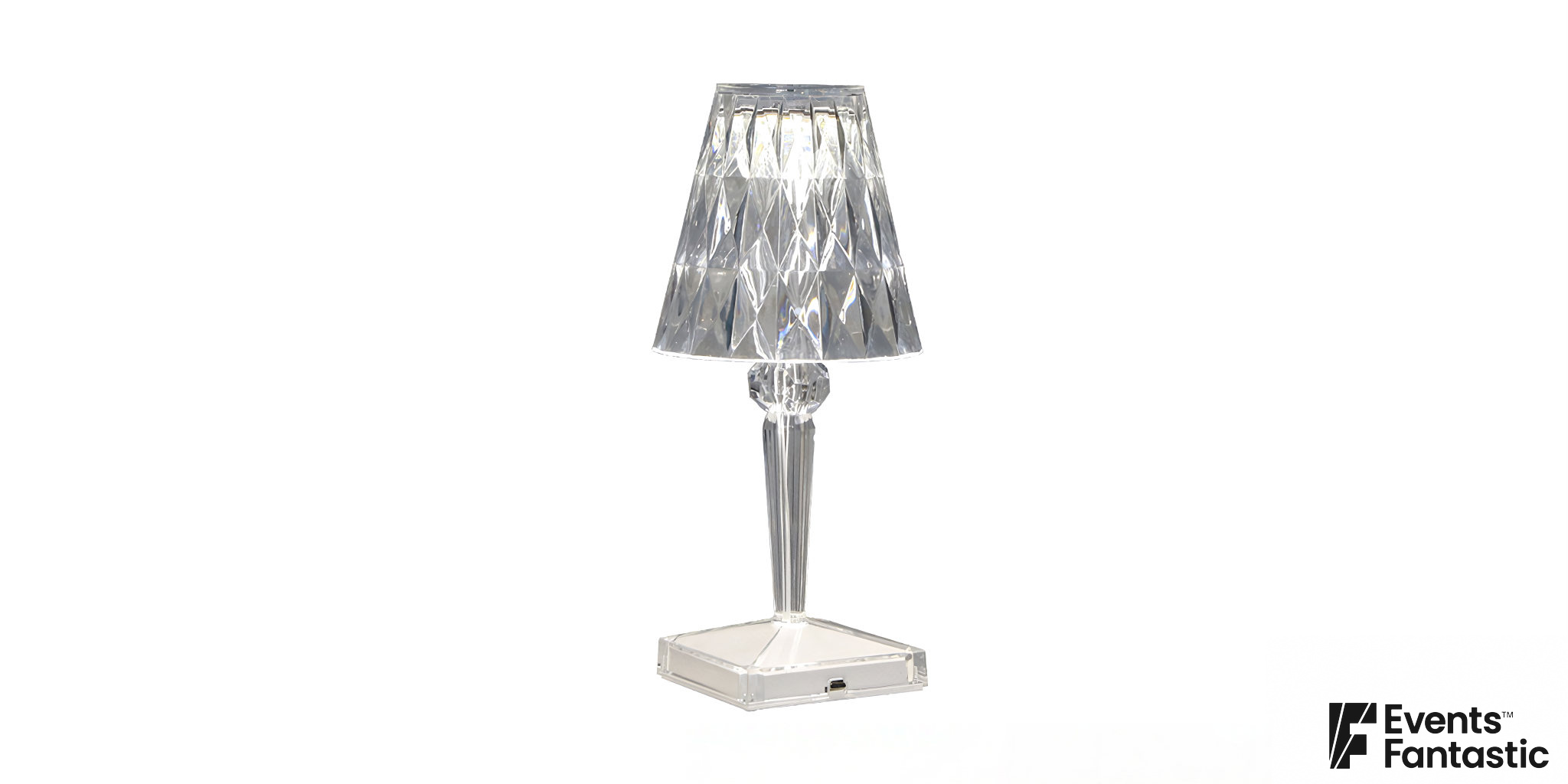 A Crystal Deco LED lamp with a faceted shade and a clear base, designed as an elegant centerpiece. ©2023 Events Fantastic.