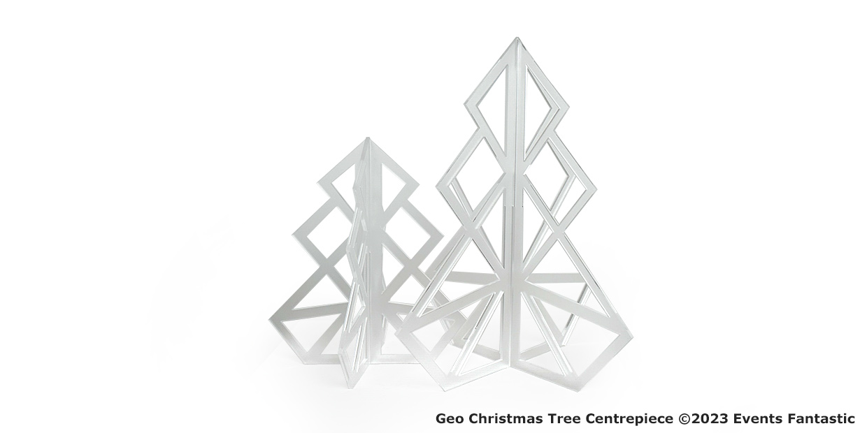 Two geometrically styled, silver metallic Christmas tree centerpieces with a modern, angular design are displayed against a plain white background. The 35cm Christmas Tree Centrepiece adds elegance and sophistication to any holiday setting.