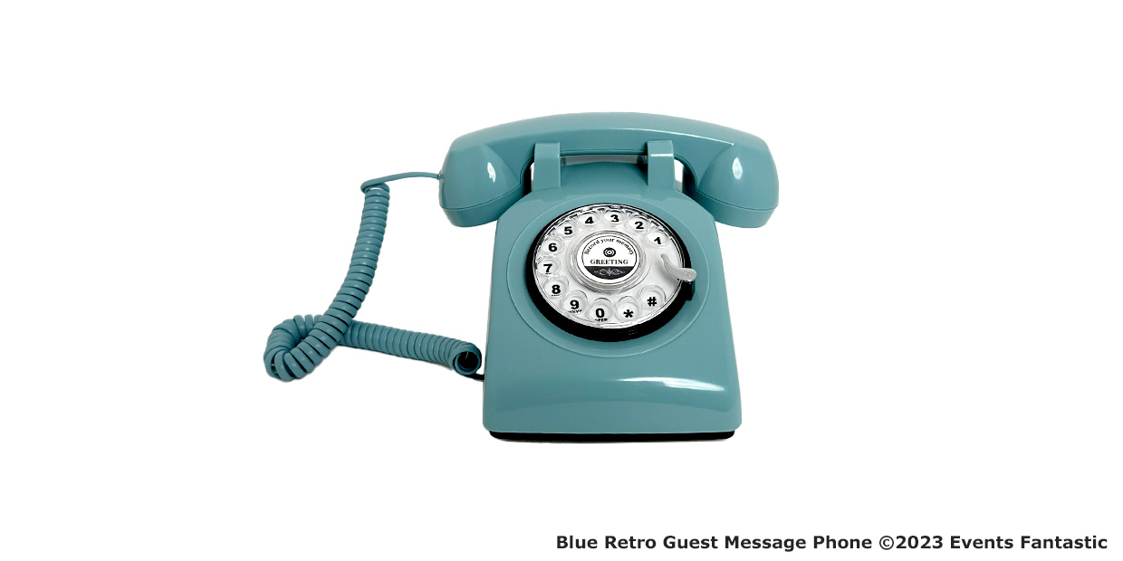 A Blue Retro rotary phone with a coiled cord, perfect as a Guest Message Phone, sits elegantly on a white background.