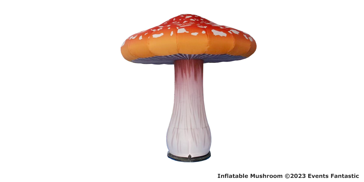 Inflatable mushroom standing at 2.4m with a tall white stem, a red cap adorned with white spots, and event branding in the bottom corner.