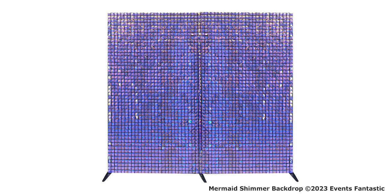 A freestanding, rectangular mermaid shimmer backdrop with blue and purple gradient hues, composed of numerous small reflective tiles.