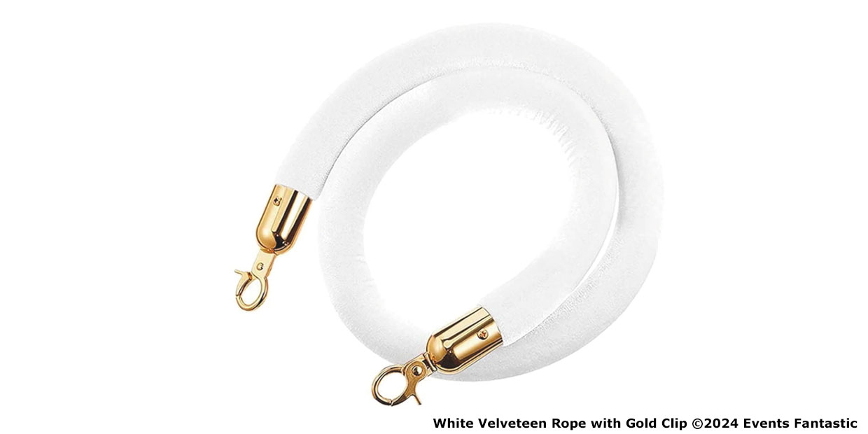 White velvet rope with gold clips on both ends, coiled loosely on a white background. Perfectly paired with gold bollards for an elegant event setup. ©2024 Events Fantastic.