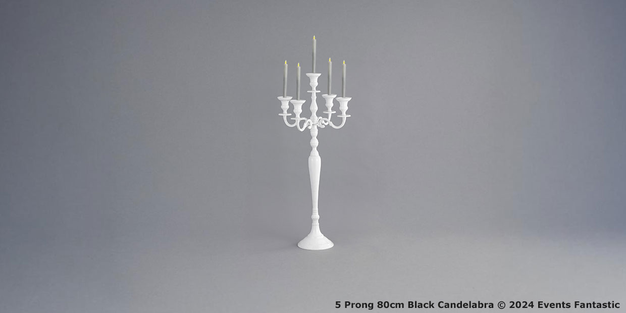 A white, five-pronged candelabra stands on a plain gray background. The image includes the text: "Chrome 5 Prong 80cm Black Candelabra © 2024 Events Fantastic."
