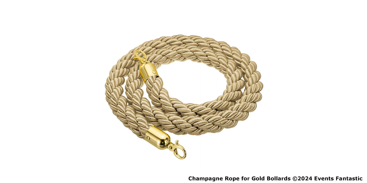 A coiled champagne-colored rope with gold ends and silver clips.