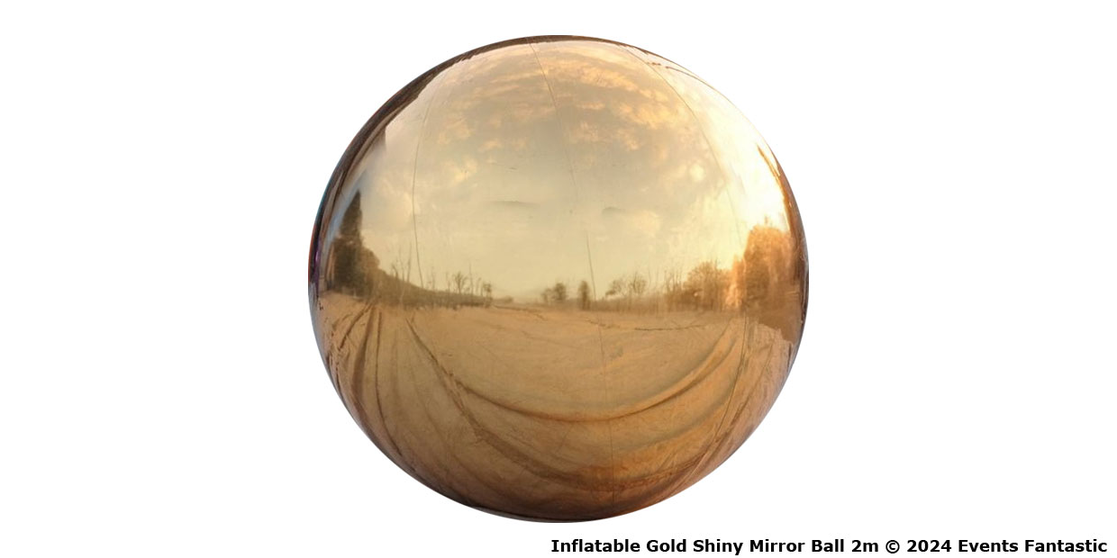 Inflatable gold shiny mirror ball with a 2-meter diameter reflecting a beautiful landscape. © 2024 Events Fantastic.