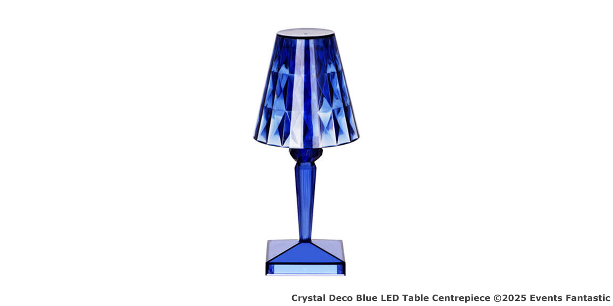 Blue crystal LED table lamp with a faceted shade and geometric base, making a stunning LED Centrepiece, displayed on a white background.