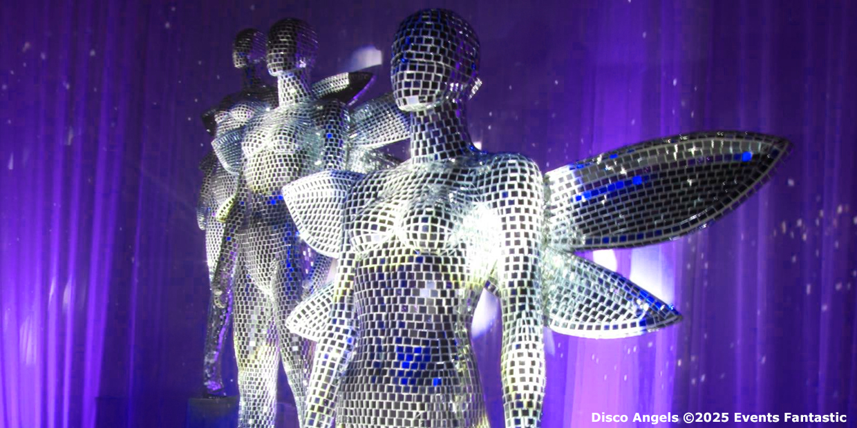 Disco Angels mannequins with mirrored mosaic surfaces and wing-like attachments are displayed against a purple-lit backdrop.