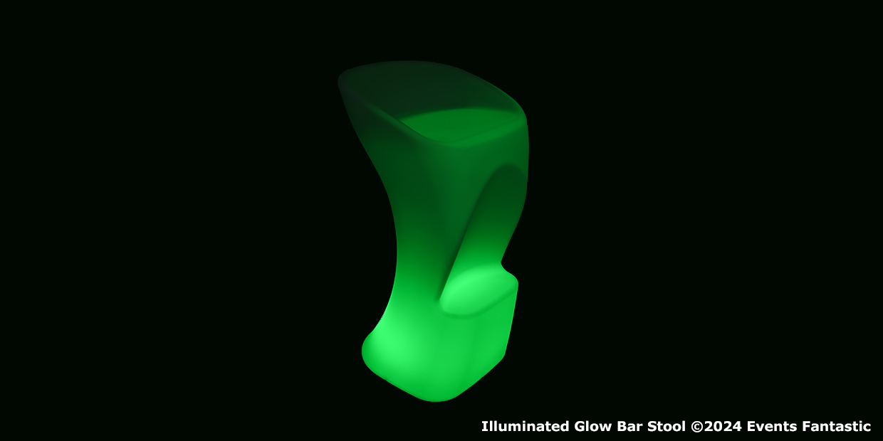 A modern, sculpted illuminated bar stool glows green in a dark setting.