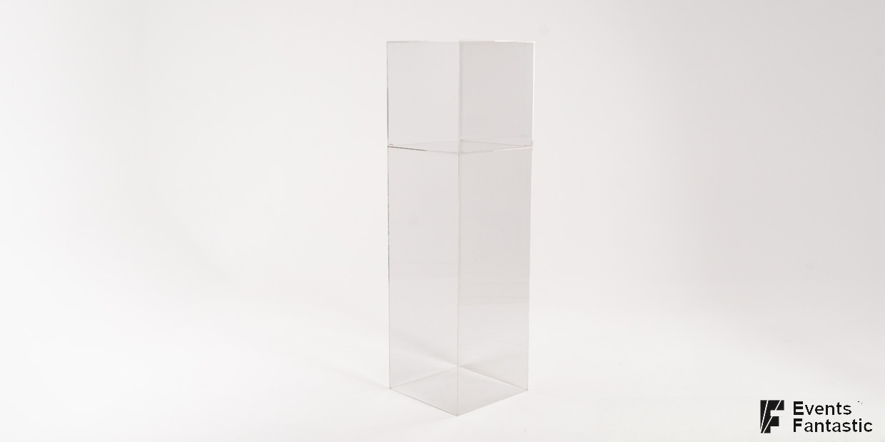 A clear acrylic plinth display stand stands on a plain white background. Available to hire from Events Fantastic.