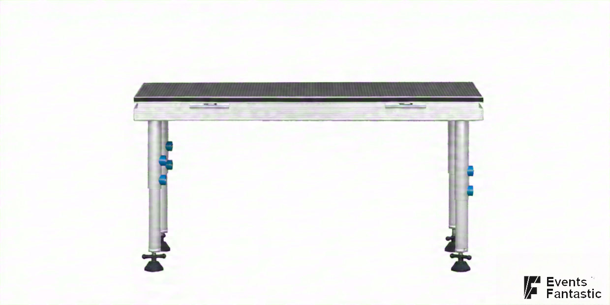 Modular stage deck standing on four adjustable aluminium stage legs with blue locking pins. Available to hire.