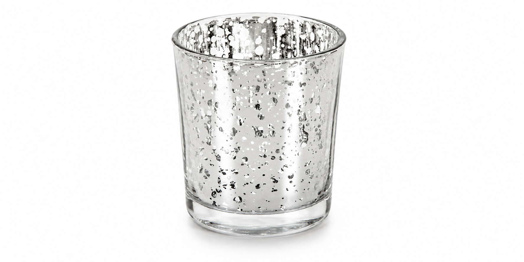 Silver mercury glass votive with a speckled mirrored surface, open circular rim and clear base on white.