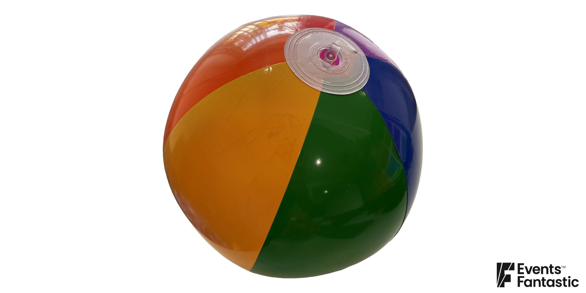 Glossy inflatable beach ball with red, orange, yellow, green, blue and purple panels. Available to hire.
